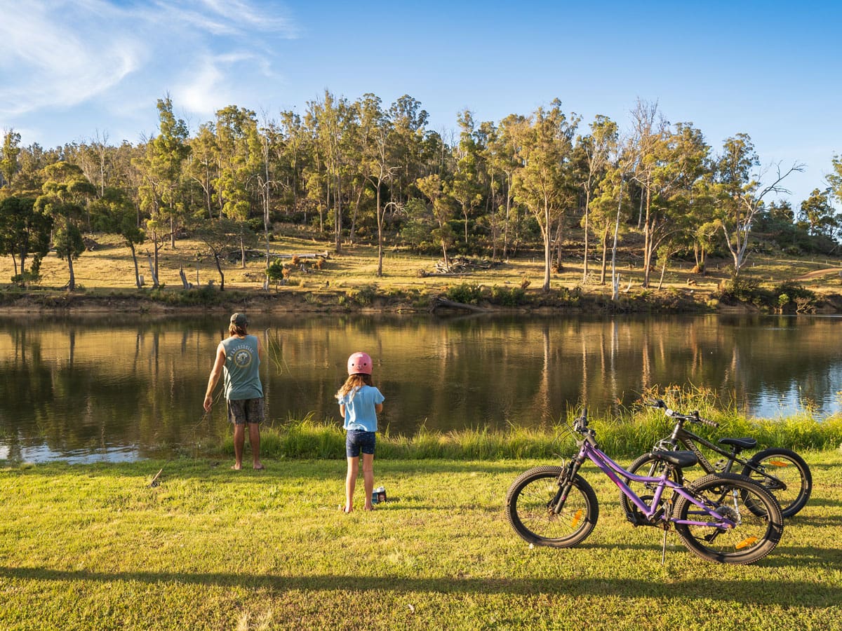 a father and daughter with their bicycles at Hadspen River