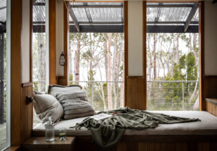 a bed with scenic bush views at The Voyager, Huon Valley