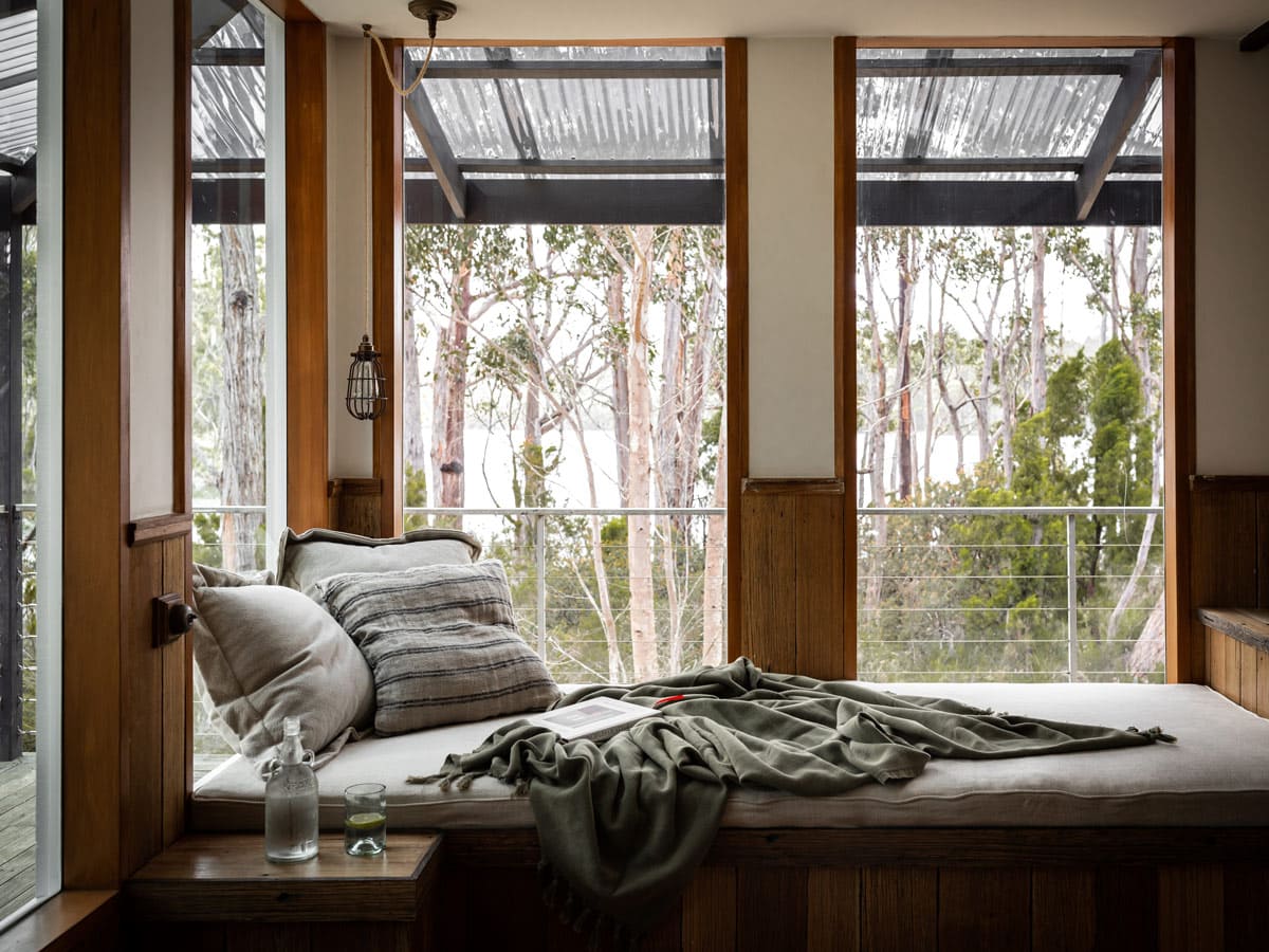 a bed with scenic bush views at The Voyager, Huon Valley