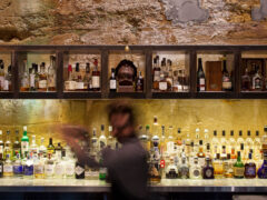 a blurry image of a bartender at Void Bar, Hobart