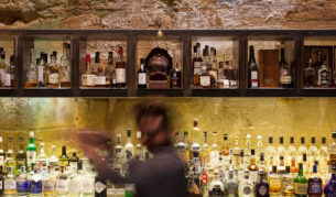 a blurry image of a bartender at Void Bar, Hobart