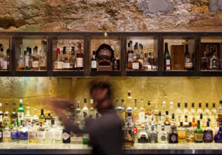 a blurry image of a bartender at Void Bar, Hobart