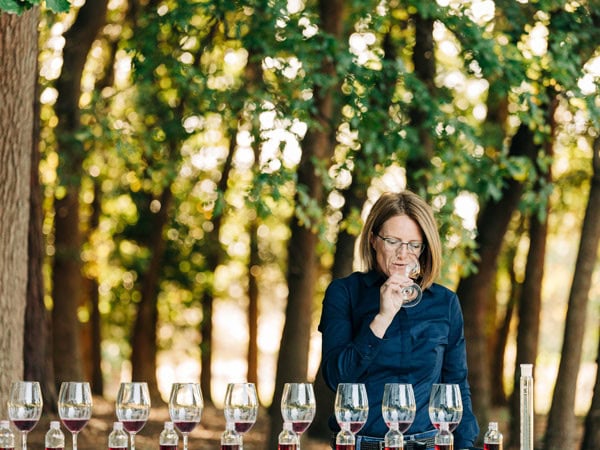 a woman sampling wines at Holm Oak