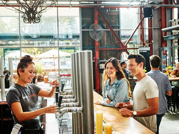 a couple ordering tap beers at Little Creatures Brewery, Fremantle