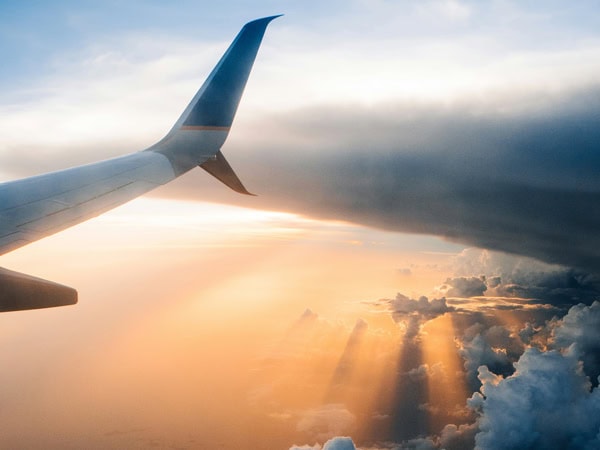 Plane wing above the clouds