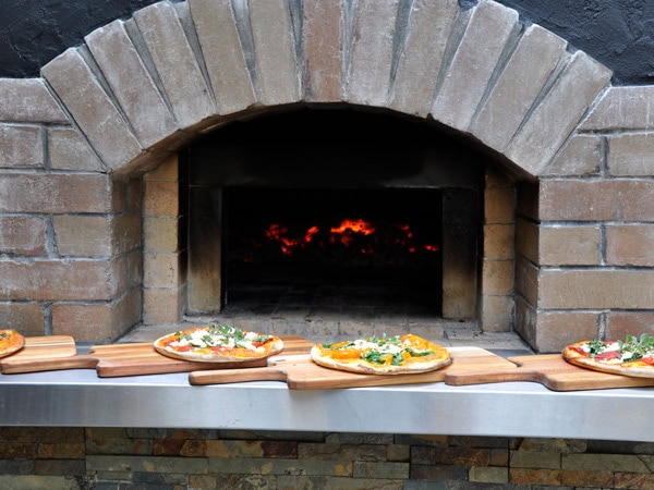 woodfired pizza outside the oven at Qdos Café