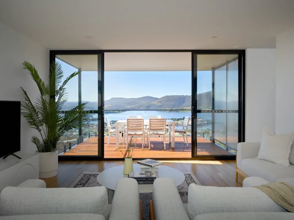 a modern living room at Rosetta Heights with a private balcony