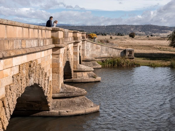 two people standing on Ross Bridge