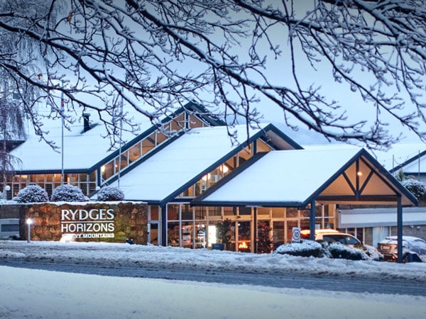 the property exterior of Rydges Horizons Snowy Mountains Jindabyne covered in snow