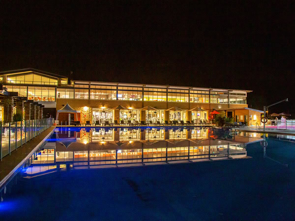 the pool view at night in Rydges Hunter Valley