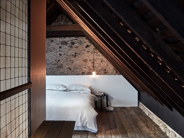 the rustic bedroom at The Barn, Hobart