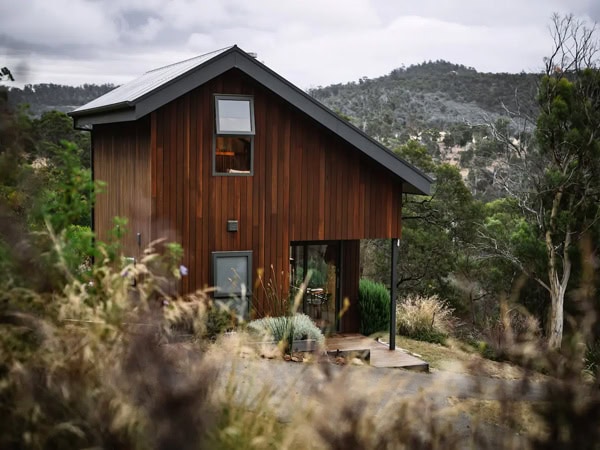 the cabin exterior of Tiny George with scenic views of the Coal River Valley