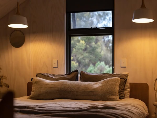 a well-lit bedroom with a window at Tiny George