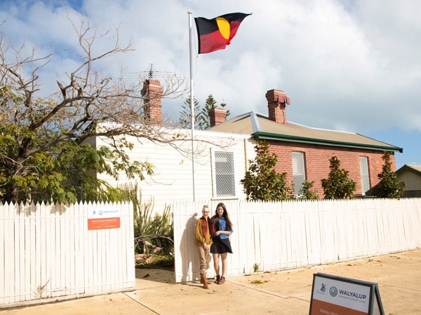 two people posing for a picture in front of Walyalup Aboriginal Cultural Centre