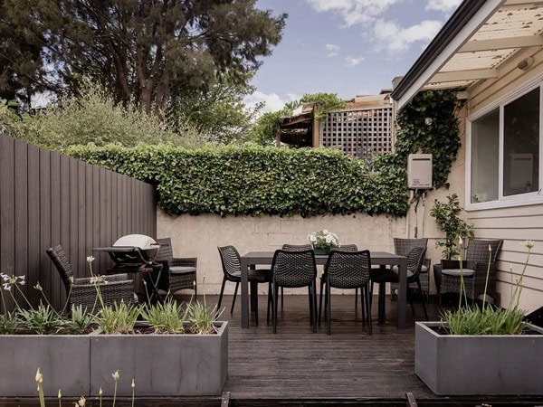 an outdoor dining area at West Hobart Cottage