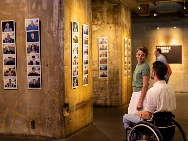 a person in a wheelchair inside the Brisbane Powerhouse