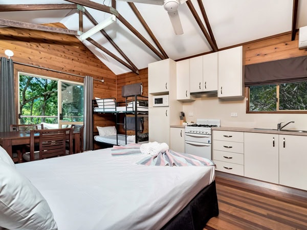 the bedroom inside a cabin at Discovery Park Airlie Beach