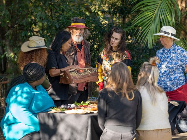 Delta Kay educating guests on a guided Indigenous tour with Explore Byron Bay