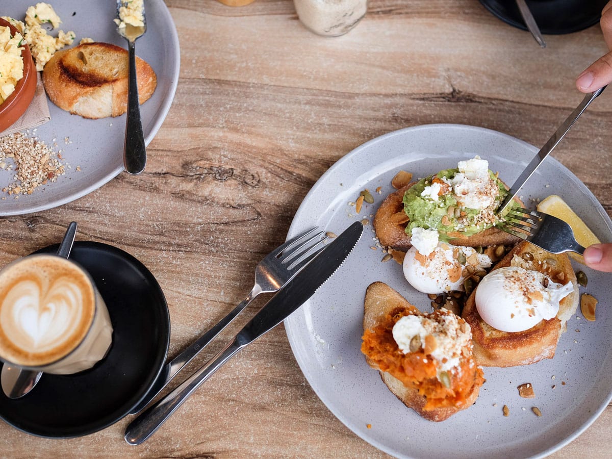 a plate of food with coffee at Bank Street + Co, Port Fairy