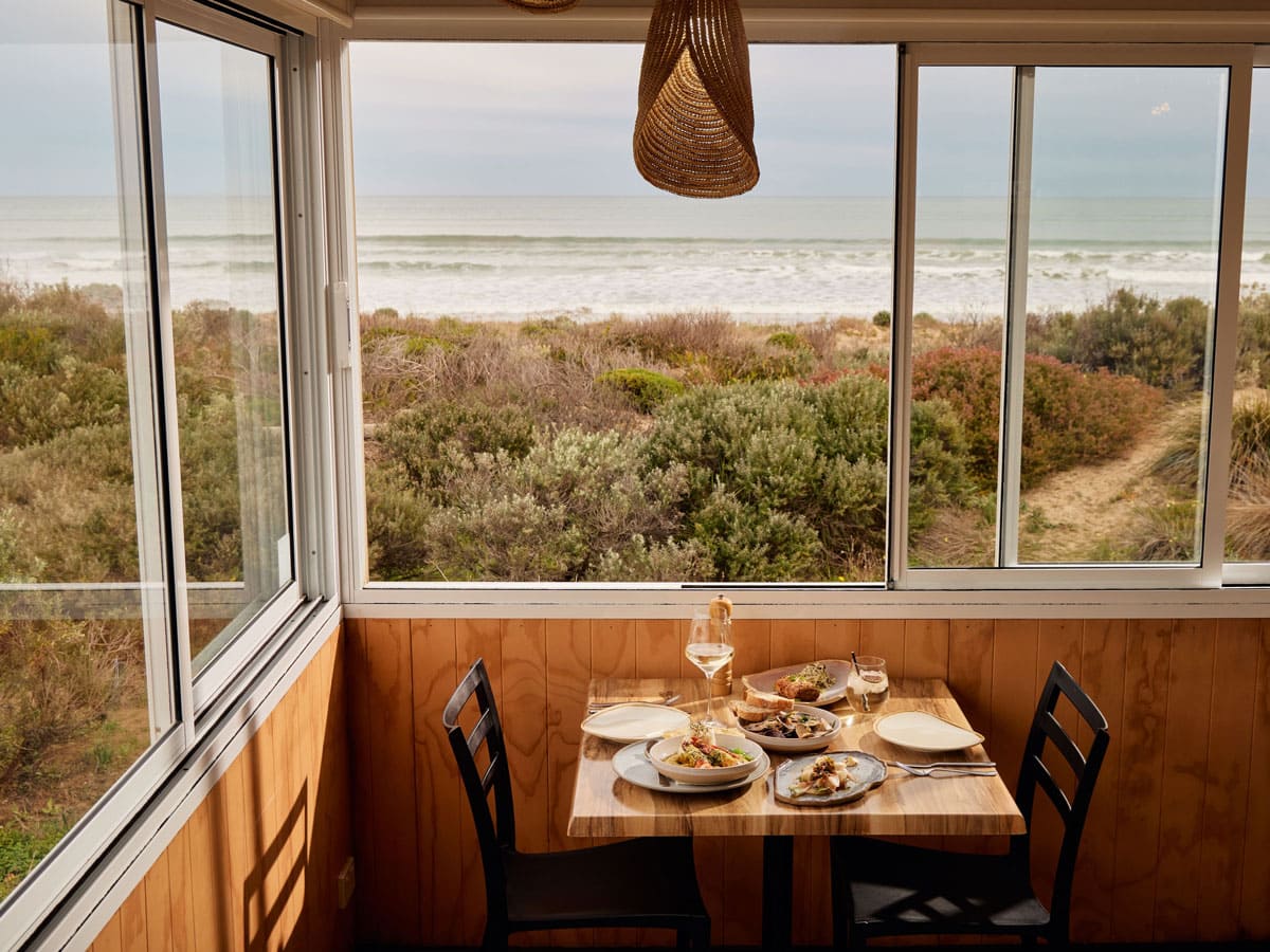 a dining setup at Kuti Shack overlooking Goolwa Beach