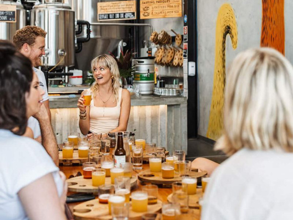 people enjoying a tasting on a Kiff & Culture food tour