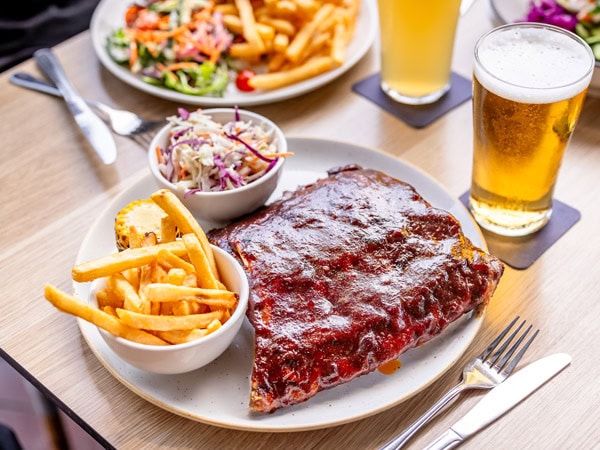 a close-up of food and beer at The Plough Inn, Brisbane