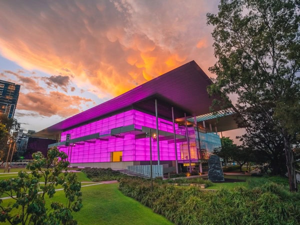 the exterior of QAGOMA with pink lighting