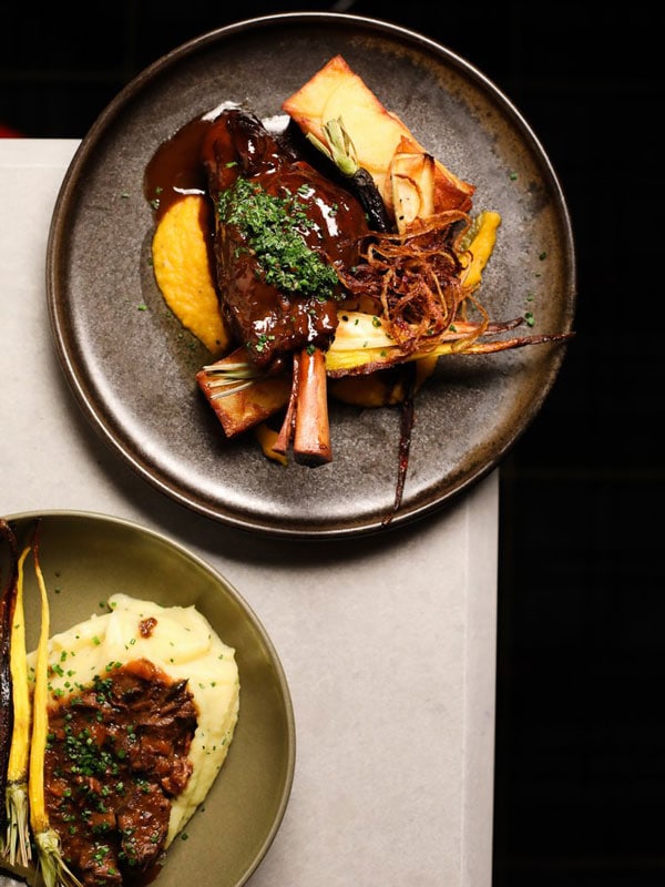 a table-top view of dishes on white table at Railway Hotel, Gosford