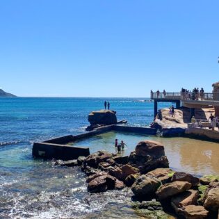 Families swimming in the rock pool at Terrigal Beach on the Central Coast