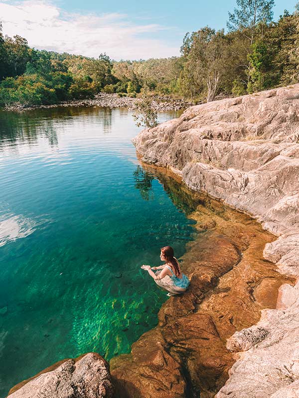 woman swimming in big crystal creek townsville