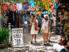two women strolling along Kuranda Original Rainforest Markets