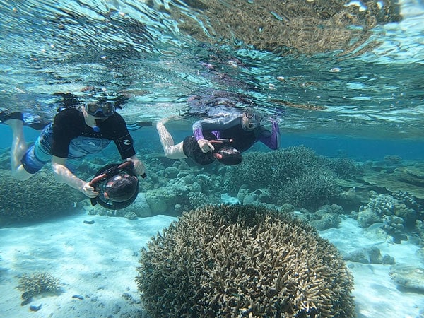 snorkelling and taking photos underwater, Cocos Keeling Islands