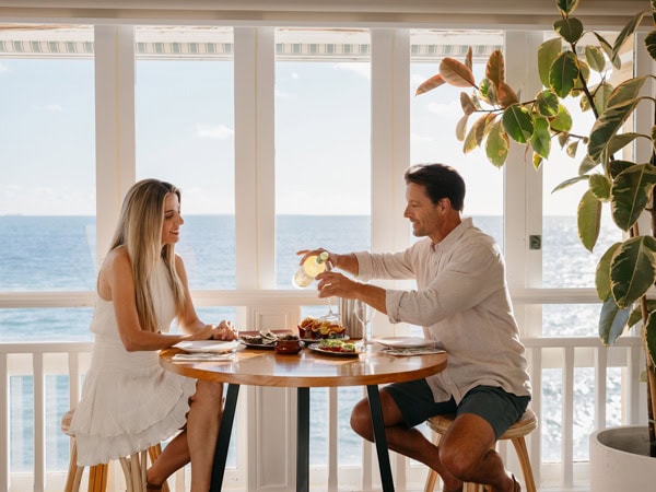 a couple dining by the sea at Cottesloe