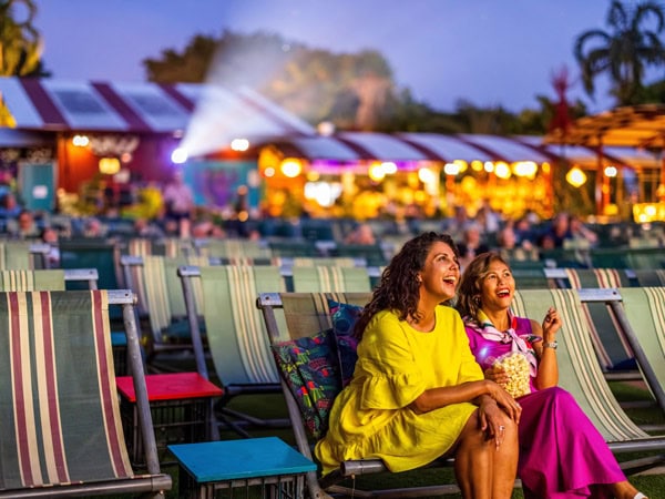 two ladies sitting in a deckchair at Deckchair Cinema, Darwin, NT