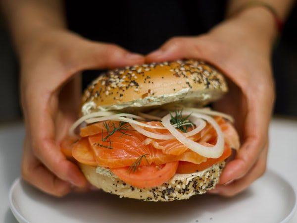 a hand holding a burger at Deli Gabe, Perth