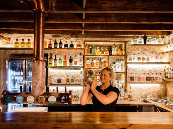 a bartender mixing up drinks at at Frolic Lane - Warrnambool