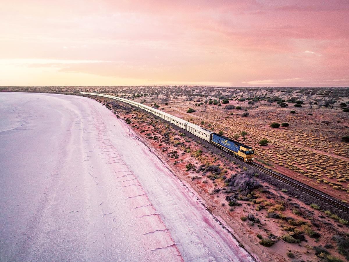 indian pacific train next to lake hart in south australia