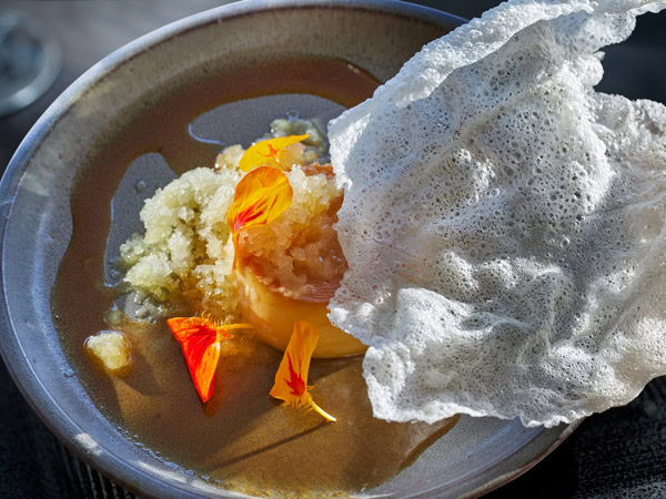 a close-up of a dish at the restaurant inside Southern Ocean Lodge