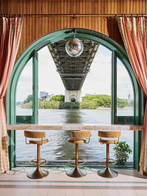 bar stools against Brisbane River backdrop at Mr. Percival’s