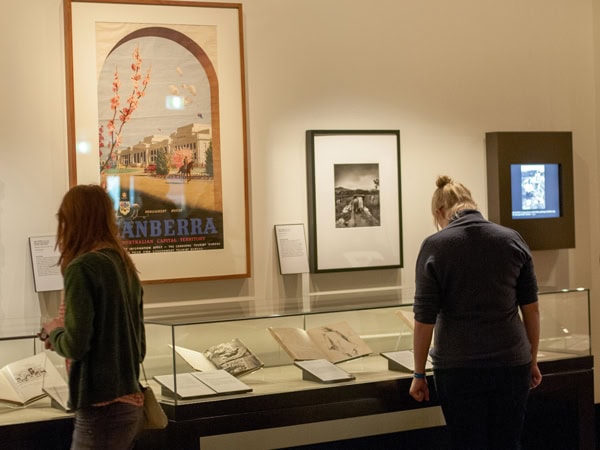 visitors looking at the displays inside the National Library of Australia, Canberra
