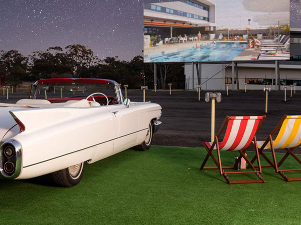 a vintage car alongside chairs at Skyline Drive-In, Blacktown, NSW