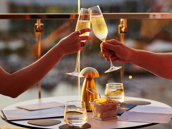 clinking wine glasses at Songbird Bar & Lounge, Perth