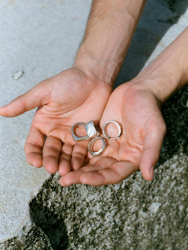 Hands outstretch to show the otis and dudley rings