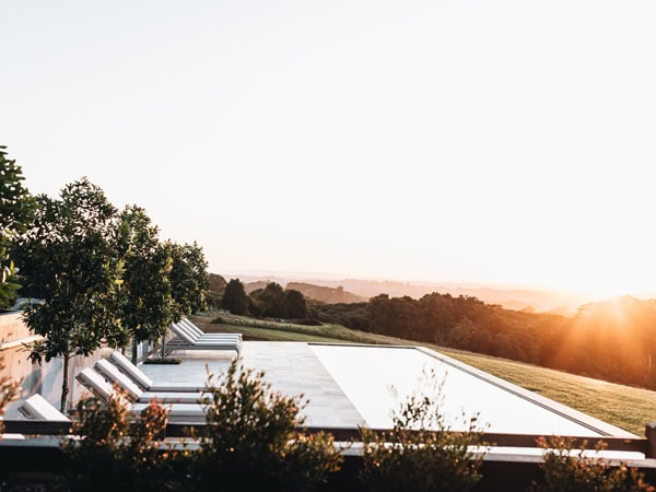 Self-contained luxury accommodation with a private heated mineral plunge pool, The Bails is surrounded by grand old fig trees and breathtaking views. 