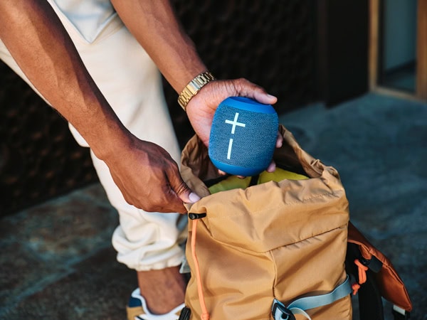 A person putting the Wonderboom 4 into a bag