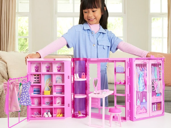 Child playing with the Barbie dream house