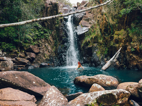 a woman cooling off at Ethel Creek Falls, Paluma Range National Park