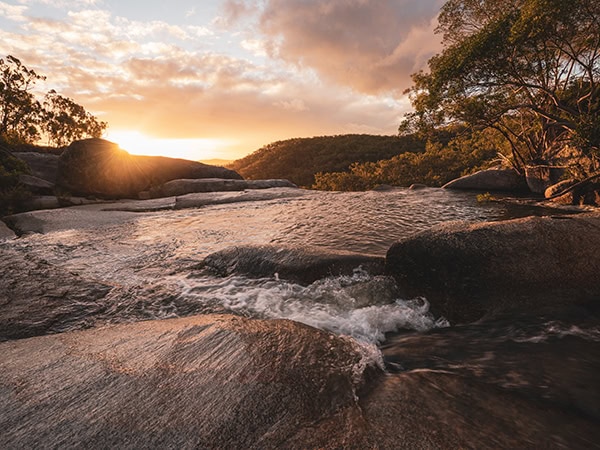 Infinity pool at the top of Davies Creek Falls at sunset. Photo by Mitchell Cox