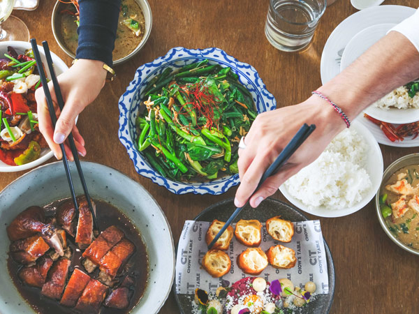 hands using chopsticks to get food, Chow’s Table, Yallingup