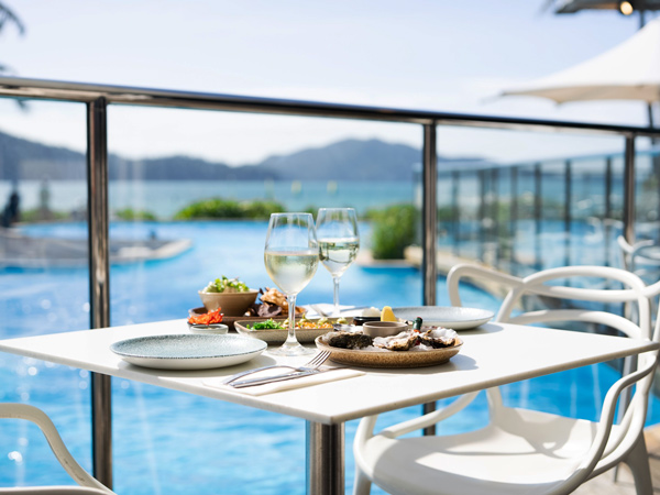 dining by the pool at Sails restaurant, Whitsundays